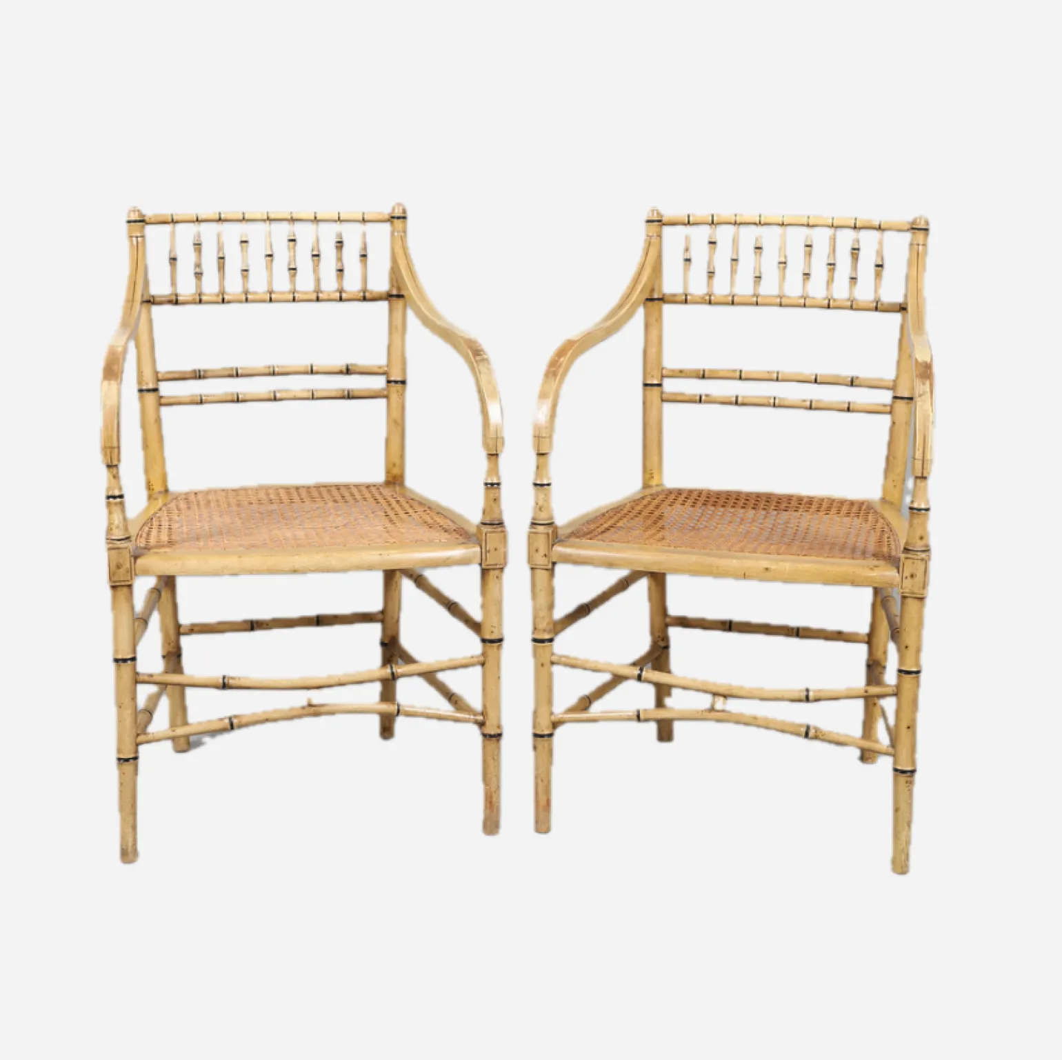 a_pair_of_cream_painted_s_0.webp A Pair of Cream Painted Simulated Bamboo Elbow Chairs