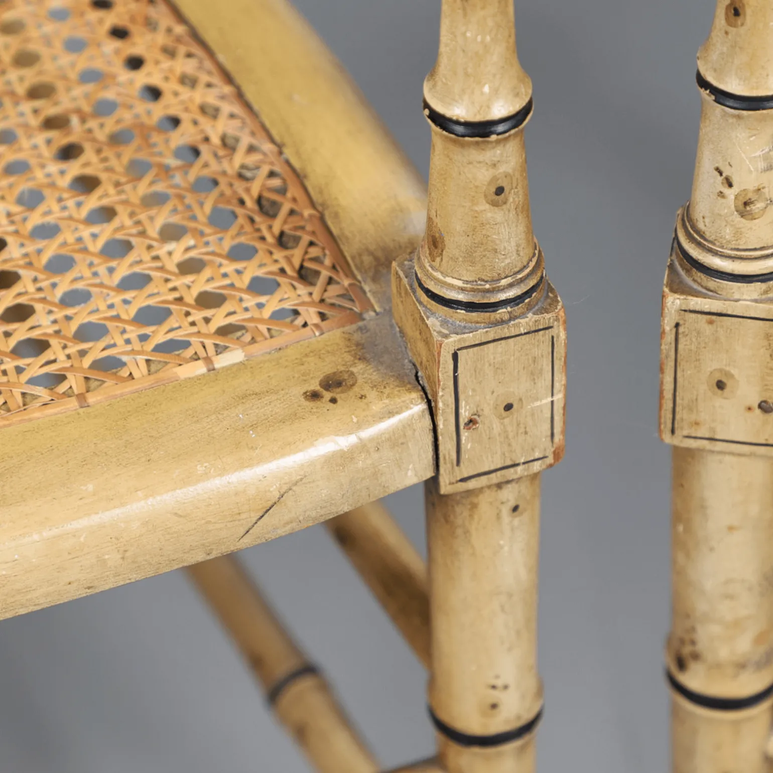 a_pair_of_cream_painted_s_1.webp A Pair of Cream Painted Simulated Bamboo Elbow Chairs