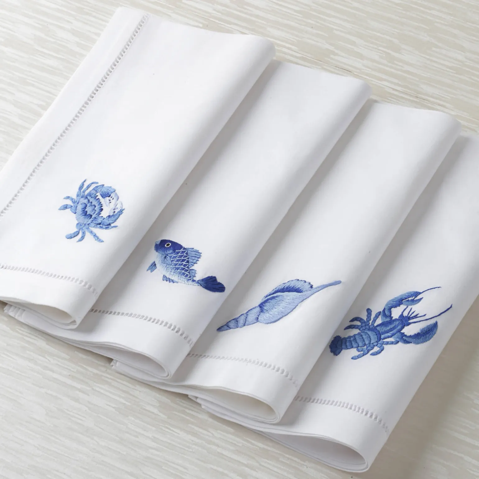 blue_sea_shell_dinner_nap_1.webp Blue Sea Shell Dinner Napkin