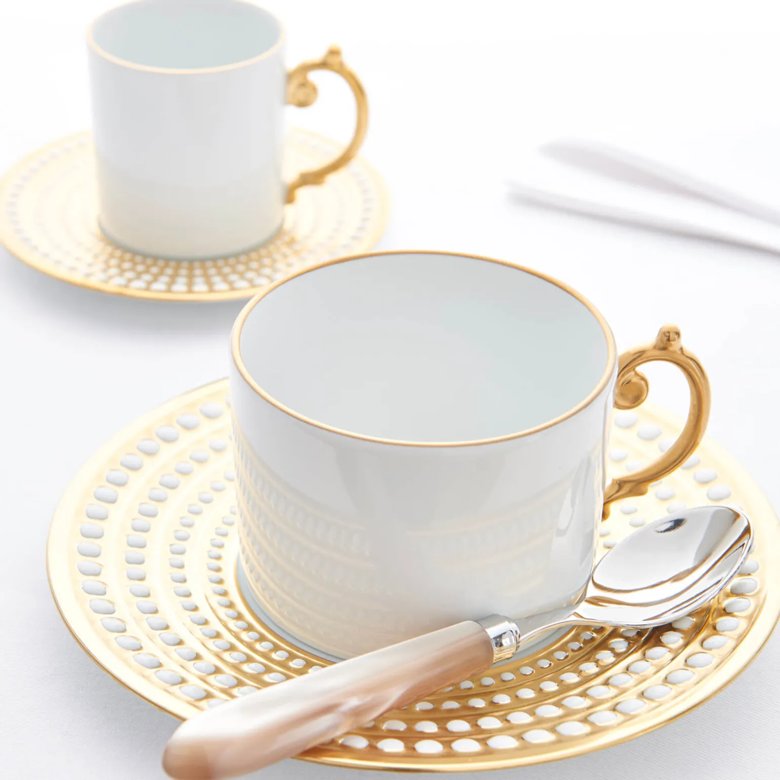 perle_gold_tea_cup__sauce_1.webp Perlée Gold Tea Cup & Saucer - Set of 2
